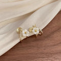 White Flower Gold Clip-on Earrings